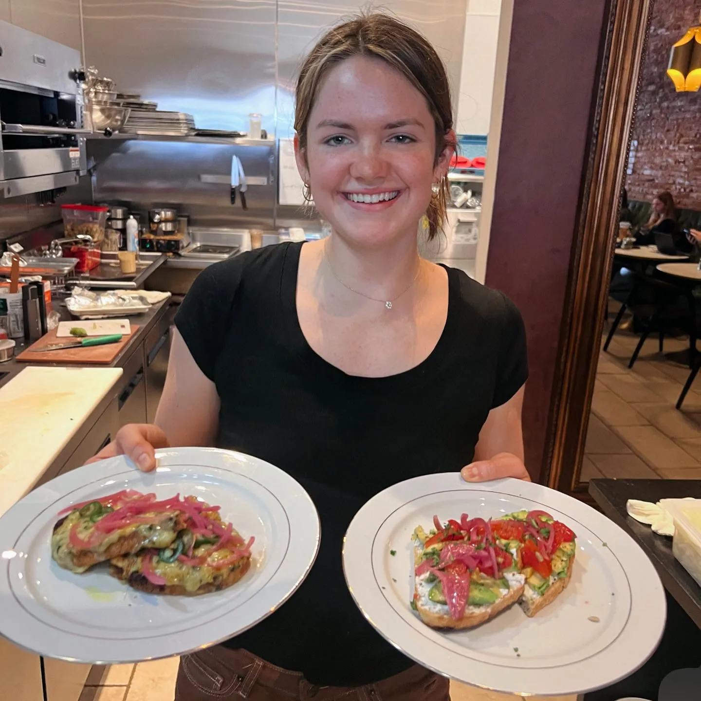 Staff member presenting dishes